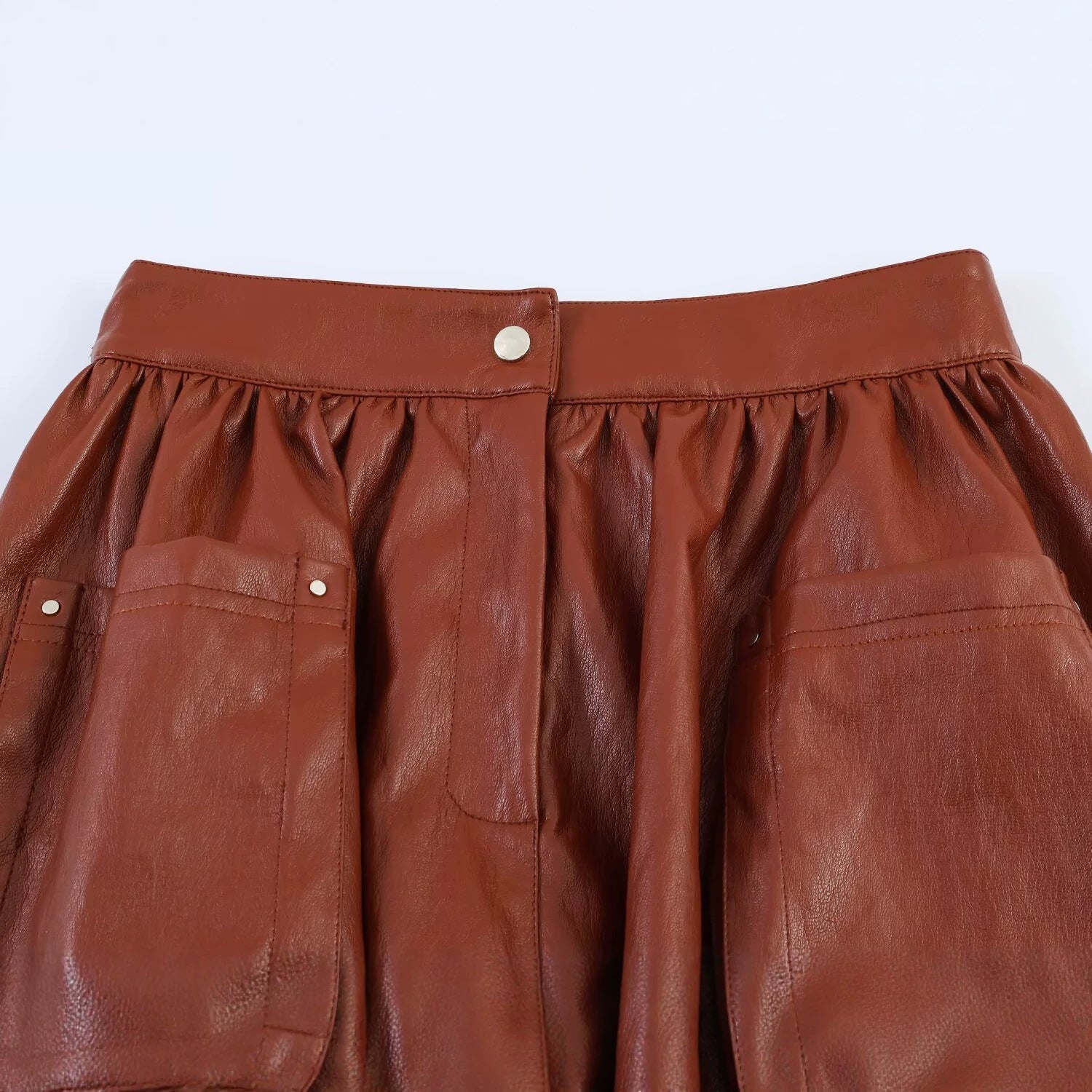 Women’s Short Balloon Skirt made of Faux Leather with High Waist and Patch Pockets Chichicherry