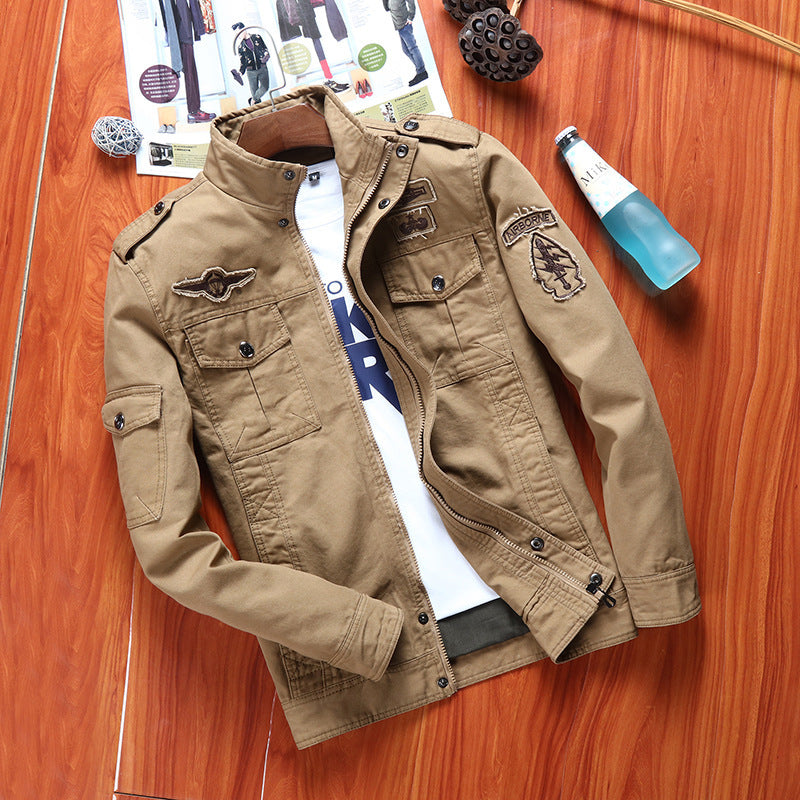 Men's canvas field jacket in military utility style with stand-up collar, shoulder patches, and multi-functional pockets Chichicherry