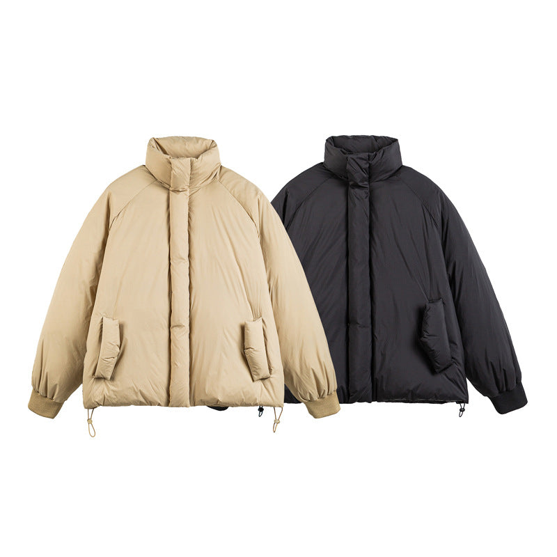 Unisex Boxy-padded short jacket with high stand-up collar, raglan sleeves and drawstring hem Chichicherry