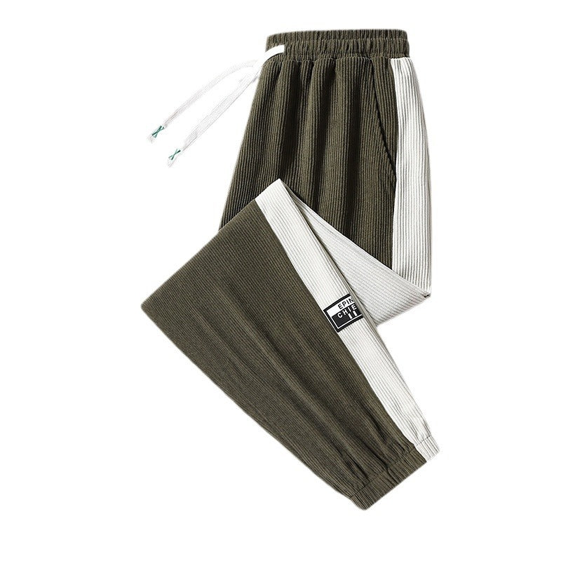 Men's jogging pants made of ribbed cotton blend with contrasting side inserts and elastic hem