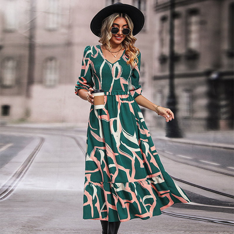 Women's midi dress with gathered smocked bodice, V-neckline and flared ruffle skirt Chichicherry