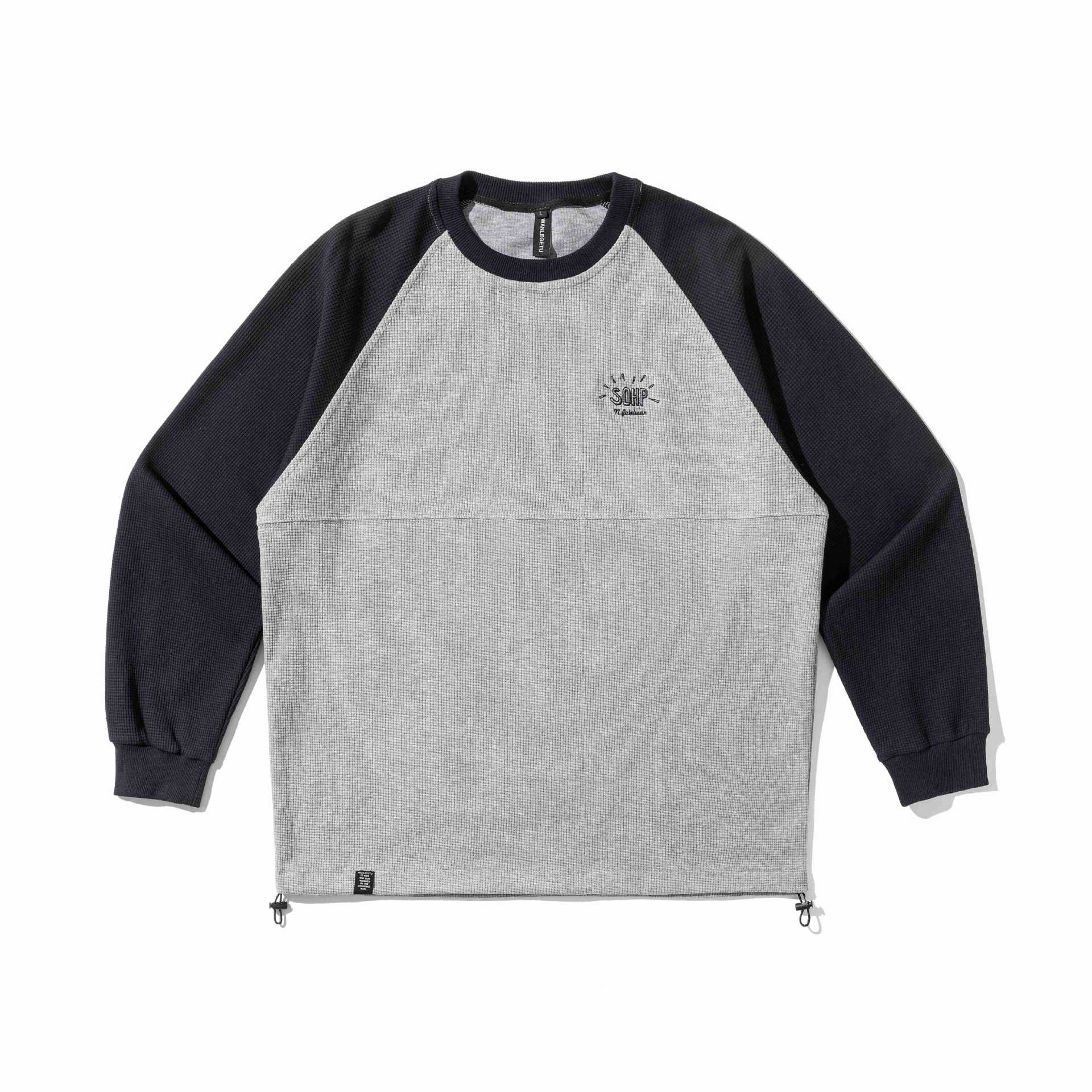 Unisex Raglan sweatshirt with thermo waffle texture, drawstring hem and subtle chest embroidery Chichicherry
