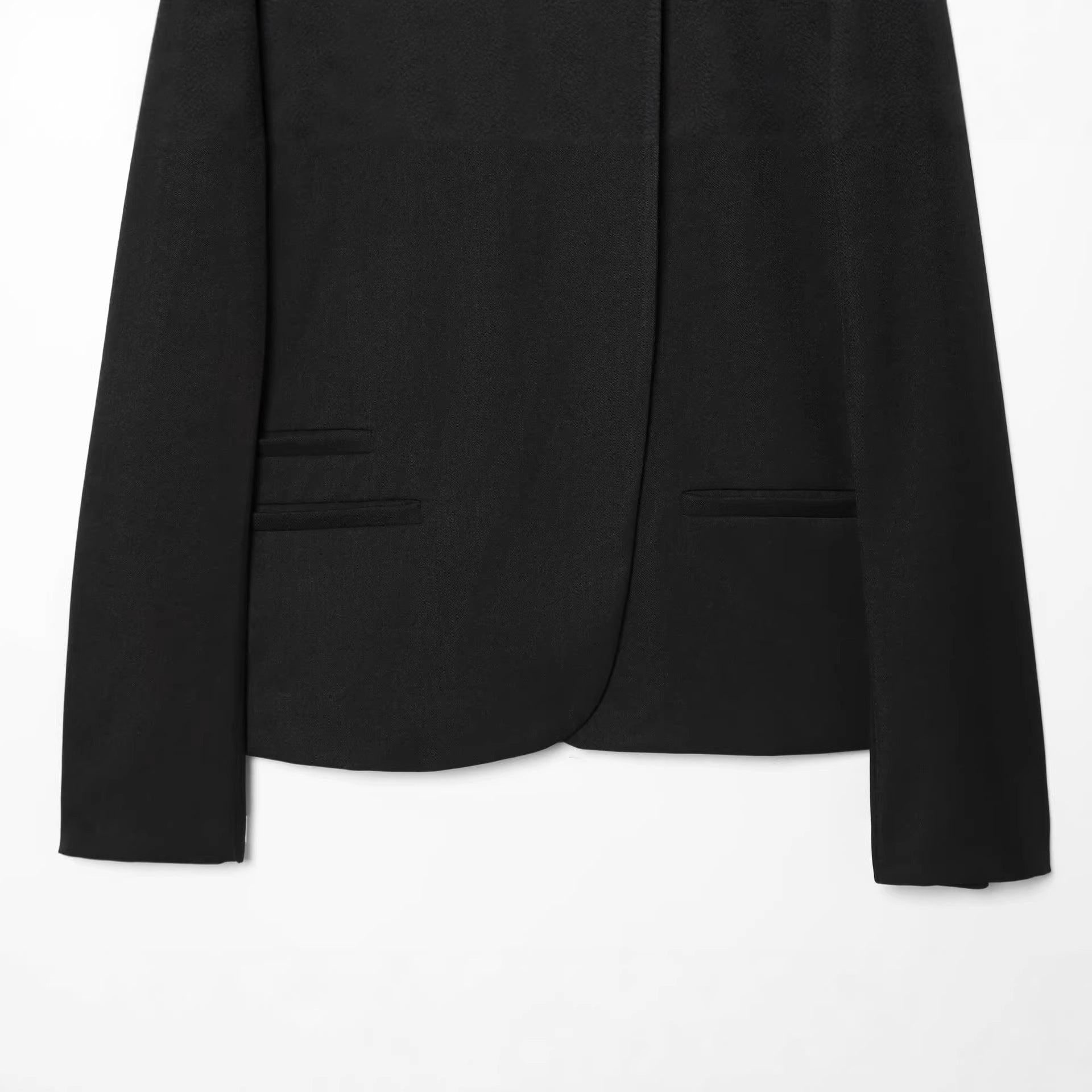 Women’s short-cut blazer with stand-up collar, asymmetrical closure, and piping pockets Chichicherry