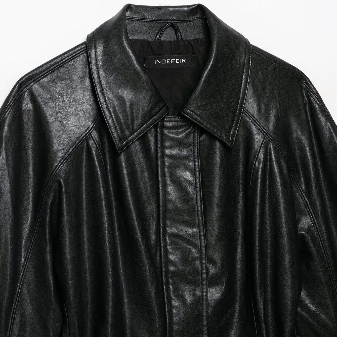 Women's short jacket made of vegan leather with a waist tie belt and dropped raglan sleeve construction Chichicherry