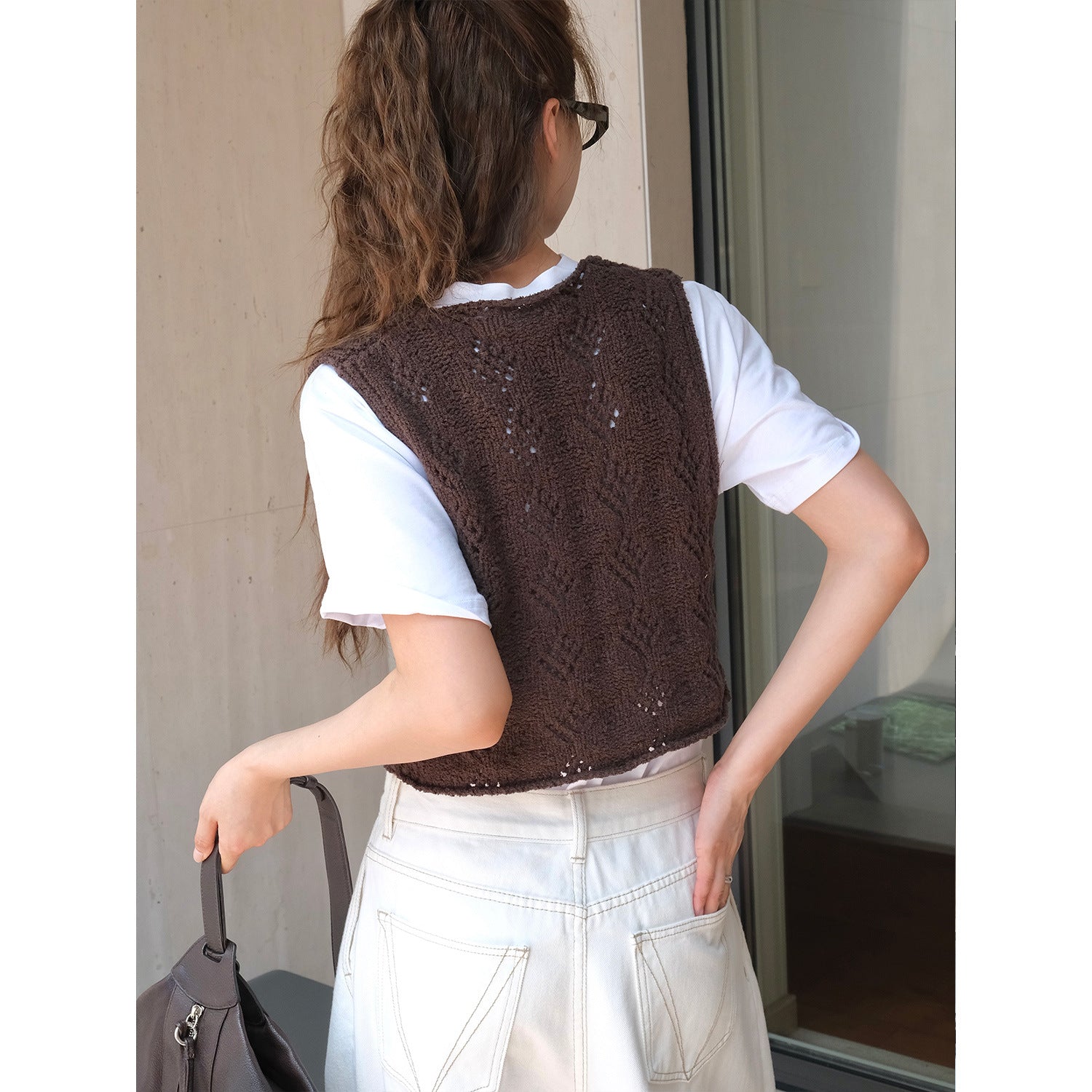 Ladies finely knitted short vest with V-neck, ajour pattern and hook closure Chichicherry