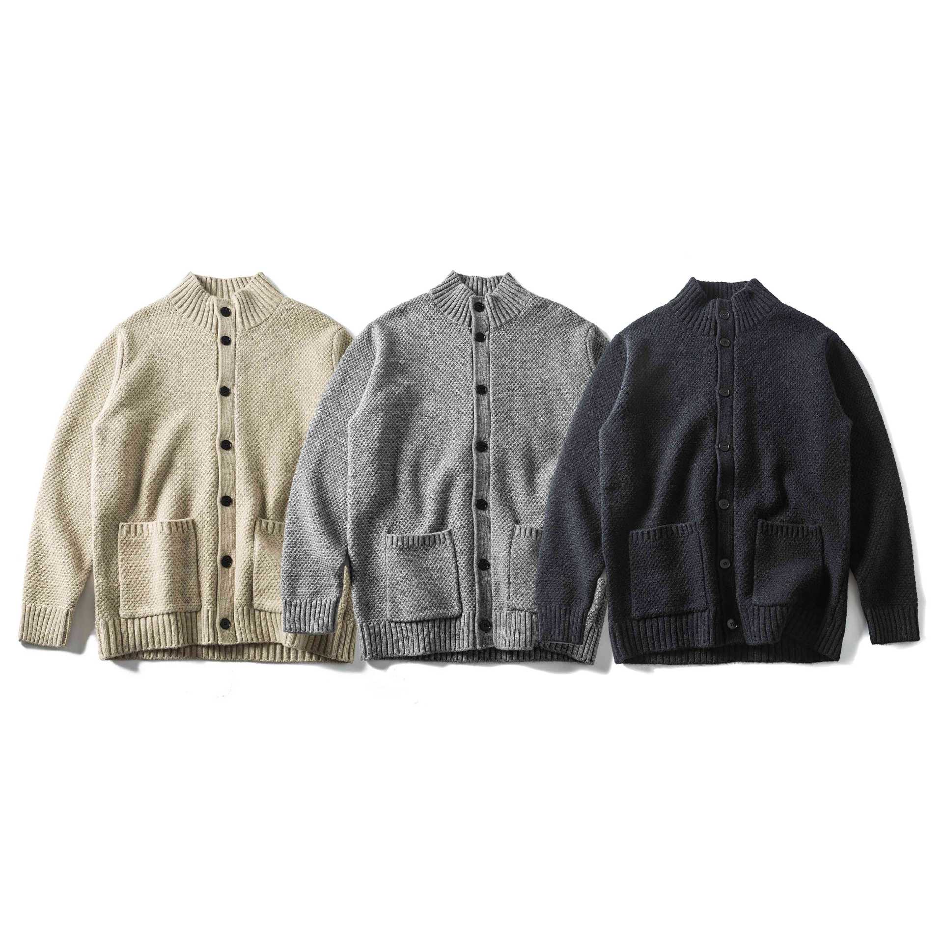 Women's bulky knit cardigan with high ribbed collar, button placket and patch pockets