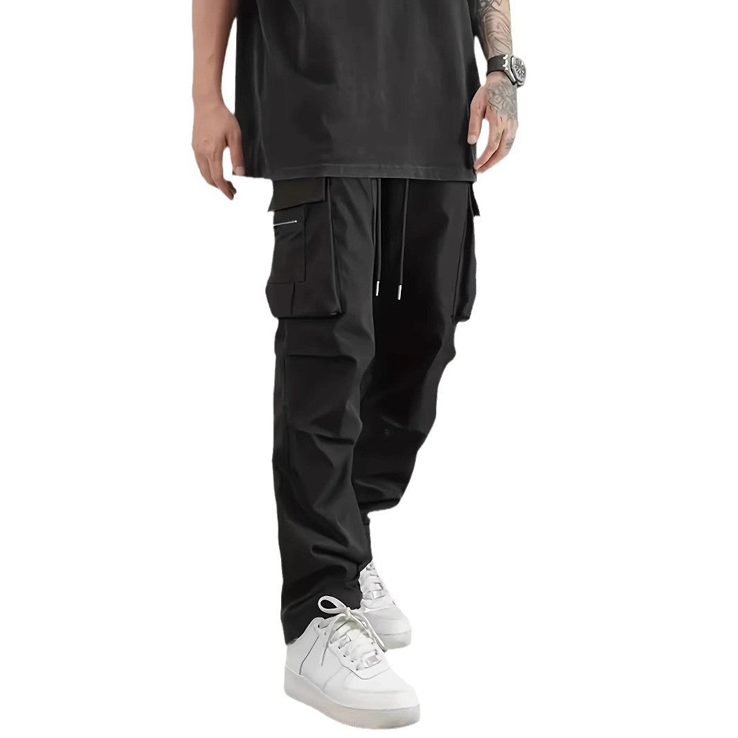 Men's wide technical cargo pants with large flap and zip pockets and drawstring waistband Chichicherry