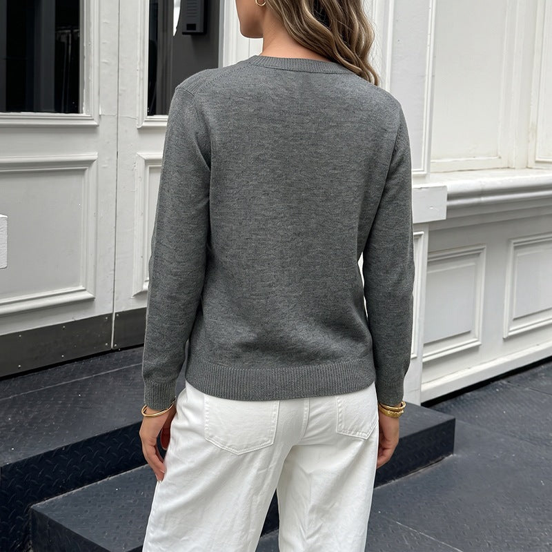 Women's fine knit cardigan with contrast colored buttons and round neck Chichicherry