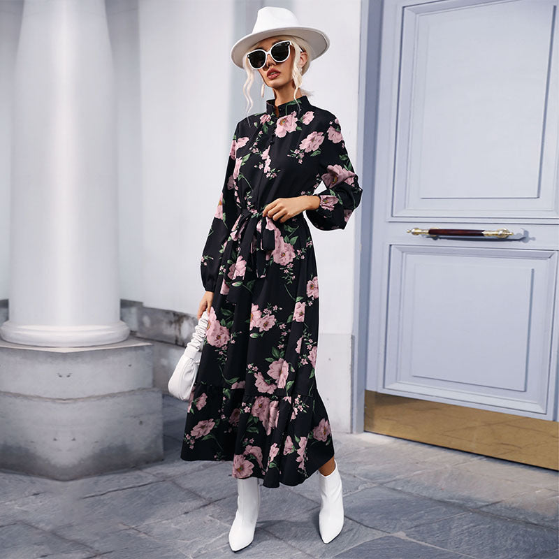 Women's maxi dress with floral allover print, stand collar, long balloon sleeves and ruffle detail.
