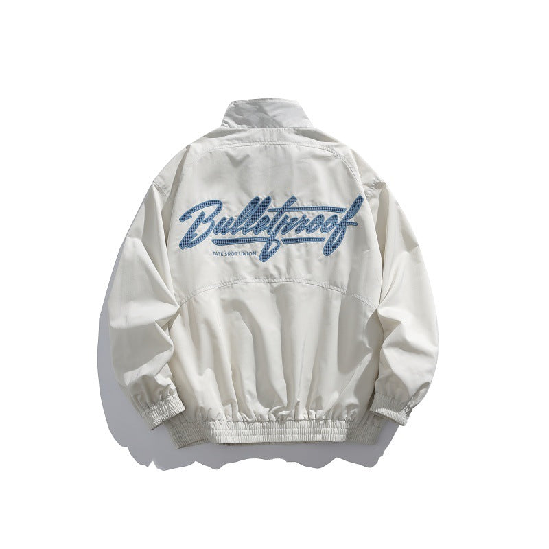 Unisex Lightweight Boxy Blouson Jacket with Stand-up Collar, Elastic Cuffs and Embroidered Chest Detail Chichicherry