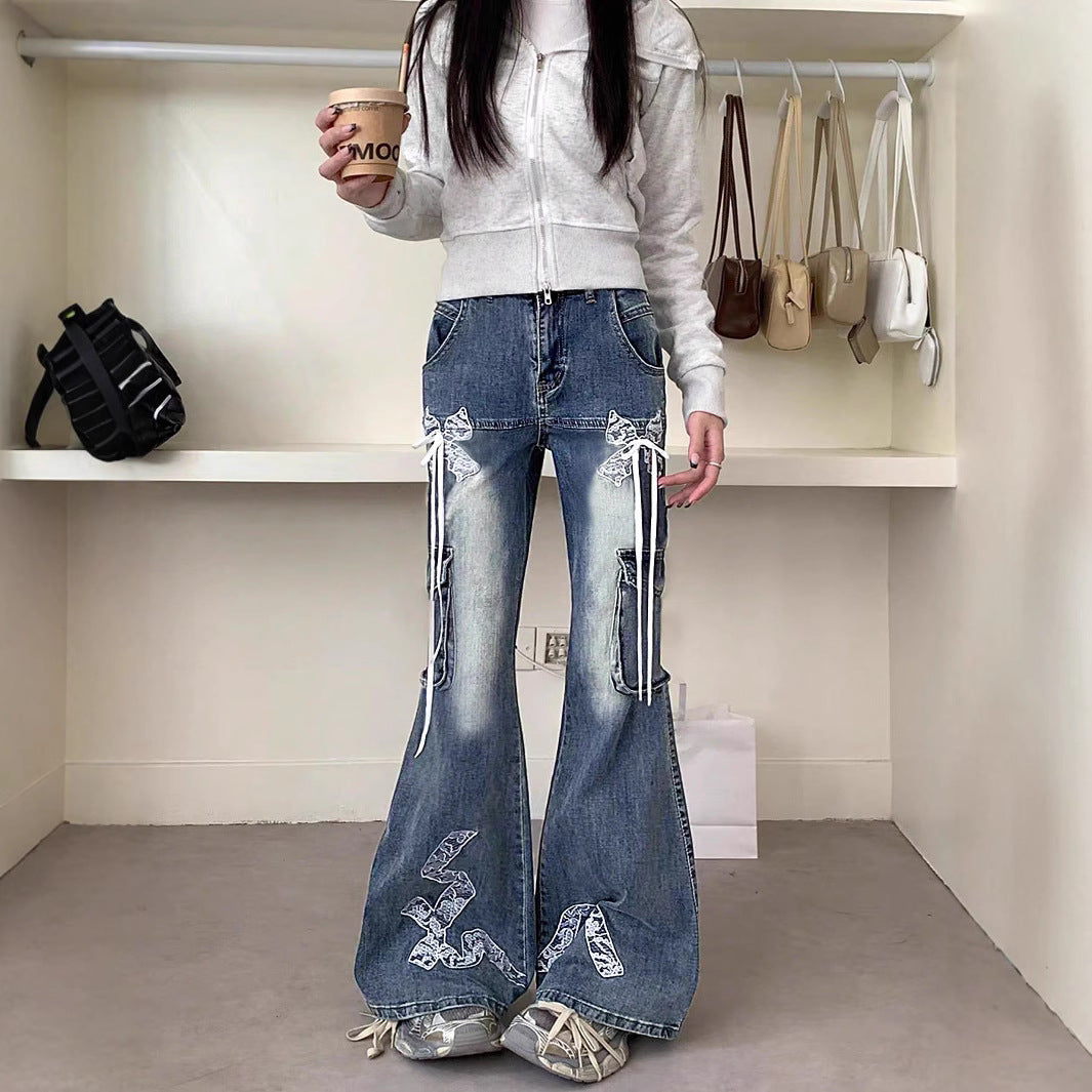 Women's wide flared cargo-style jeans with decorative ribbons, lace appliqués, and multiple pockets Chichicherry