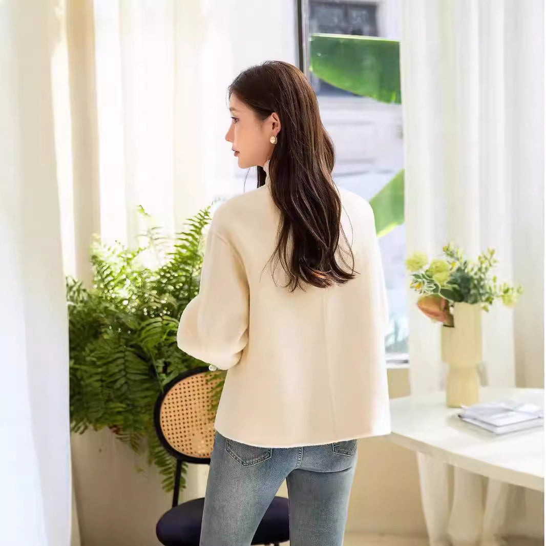 Women's short jacket with stand-up collar, pearl buttons, and contrasting cuffs Chichicherry