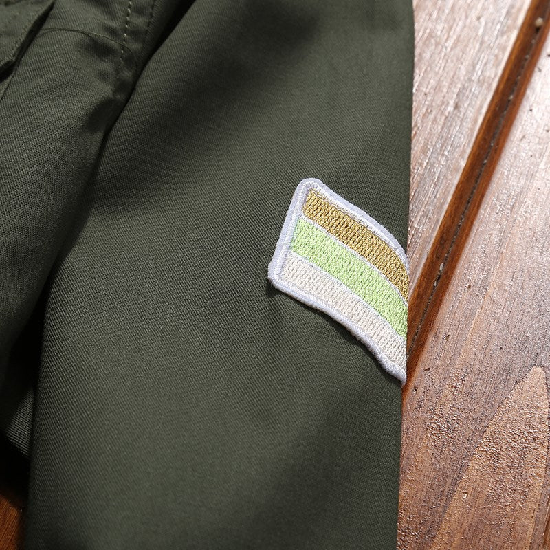 Men's utility shirt jacket with chest pockets, shoulder epaulettes, and badge applications Chichicherry