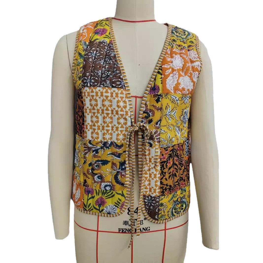 Ladies patchwork vest with tie belt, striped interior finish and contrast piping Chichicherry