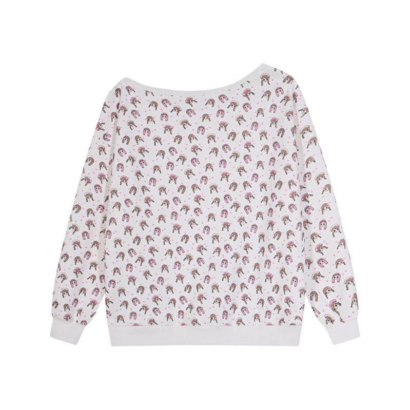 Women's sweatshirt with allover cartoon print, wide round neckline and heart patch.