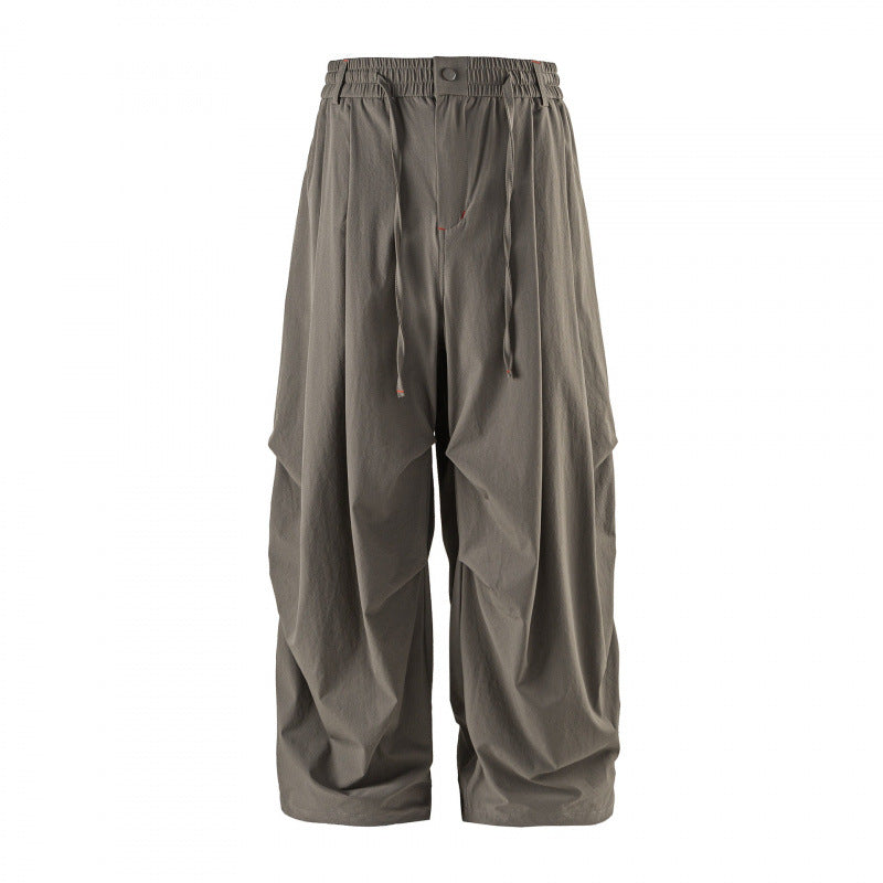 Unisex Loose-fitting technical cargo pants with elastic waistband, drawstring, and zip pockets Chichicherry