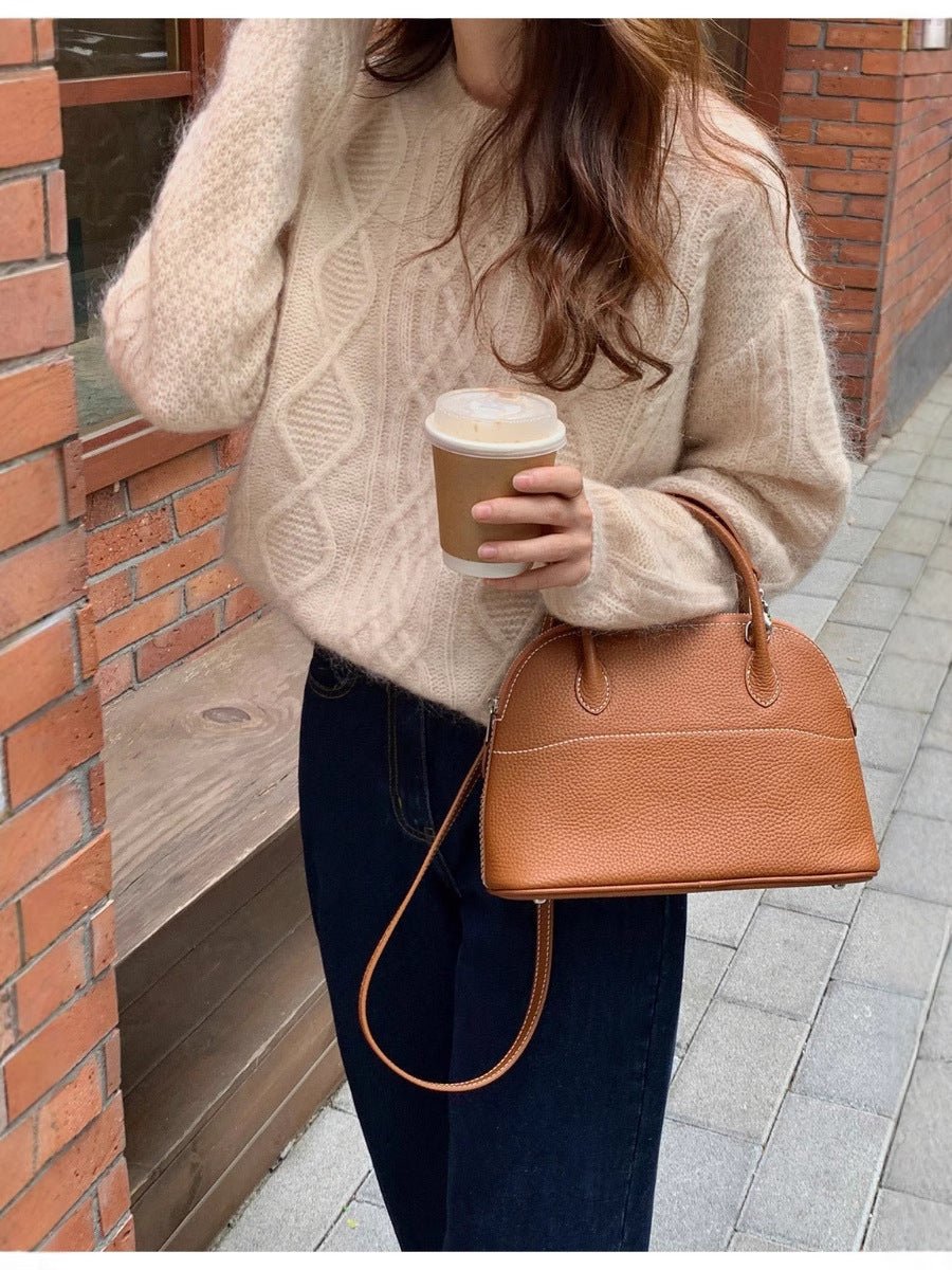 Women structured leather handbag with detachable shoulder strap and rounded body shape Chichicherry