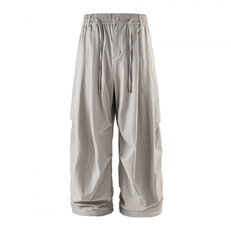 Unisex Loose-fitting technical cargo pants with elastic waistband, drawstring, and zip pockets Chichicherry