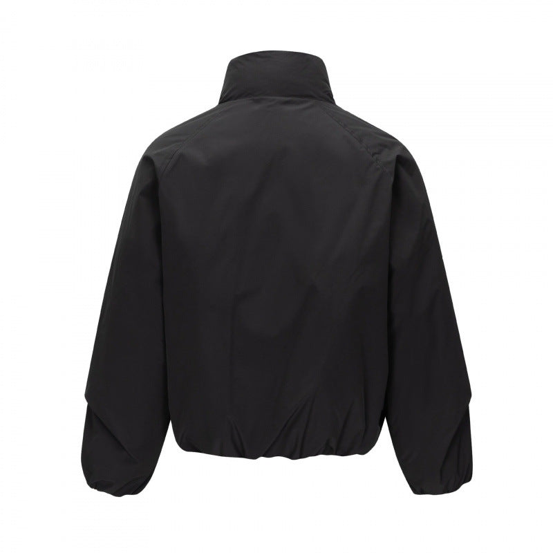 Unisex Short cut lightweight windbreaker in boxy cut with high stand-up collar and elastic hem Chichicherry