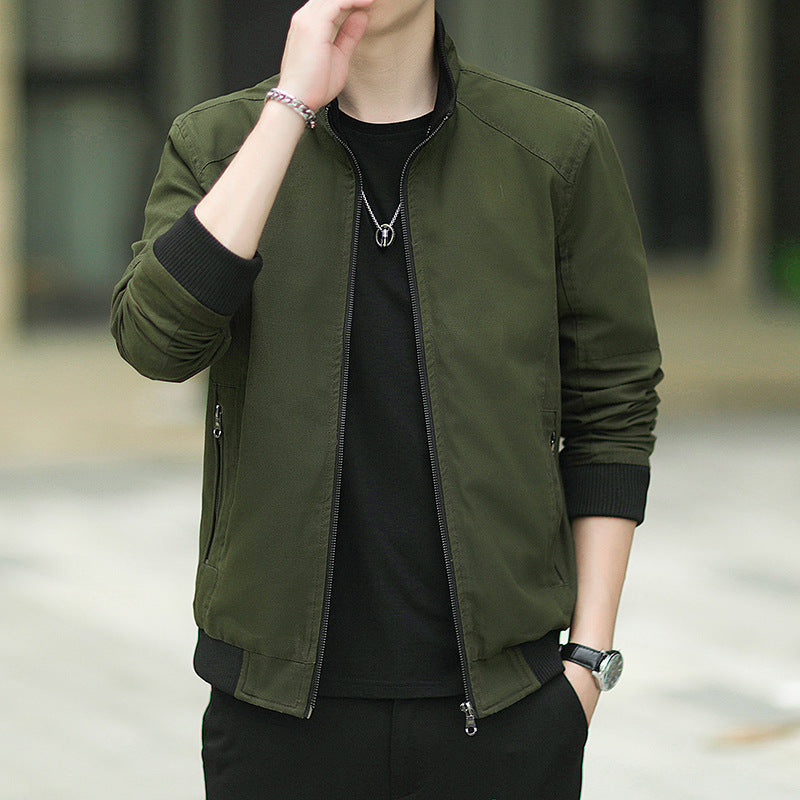 Men's slim-fitting micro canvas bomber with high stand collar, concealed zipper, and elastic ribbed cuffs.