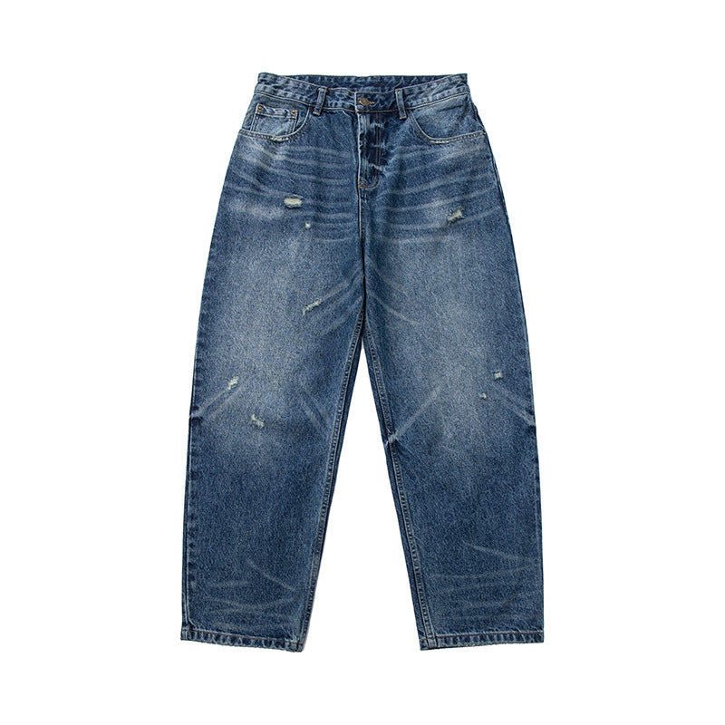 Women's high-waisted wide-cut jeans in a used look with button closure and subtle rips