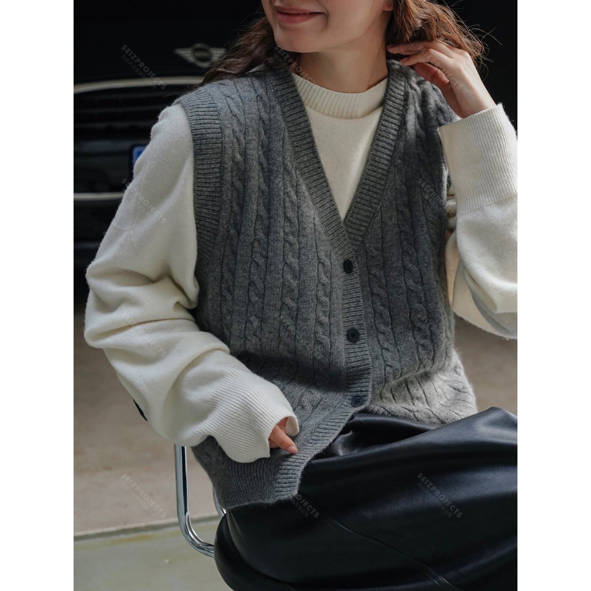 Women's chunky knit cable vest with deep V-neck and button placket Chichicherry