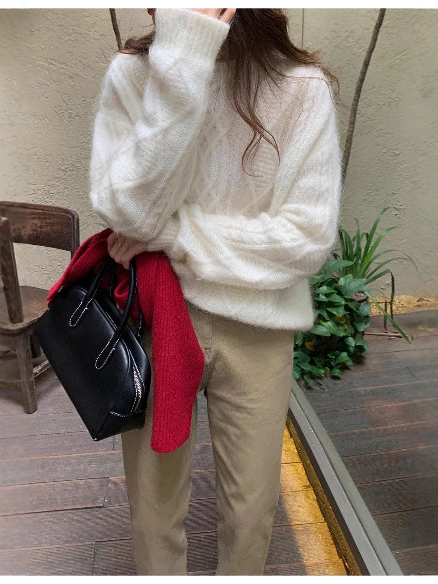 Women structured leather handbag with detachable shoulder strap and rounded body shape Chichicherry