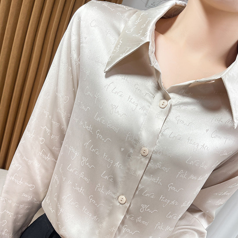 Women’s satin blouse with delicate jacquard writing, pointed shirt collar and continuous button closure Chichicherry