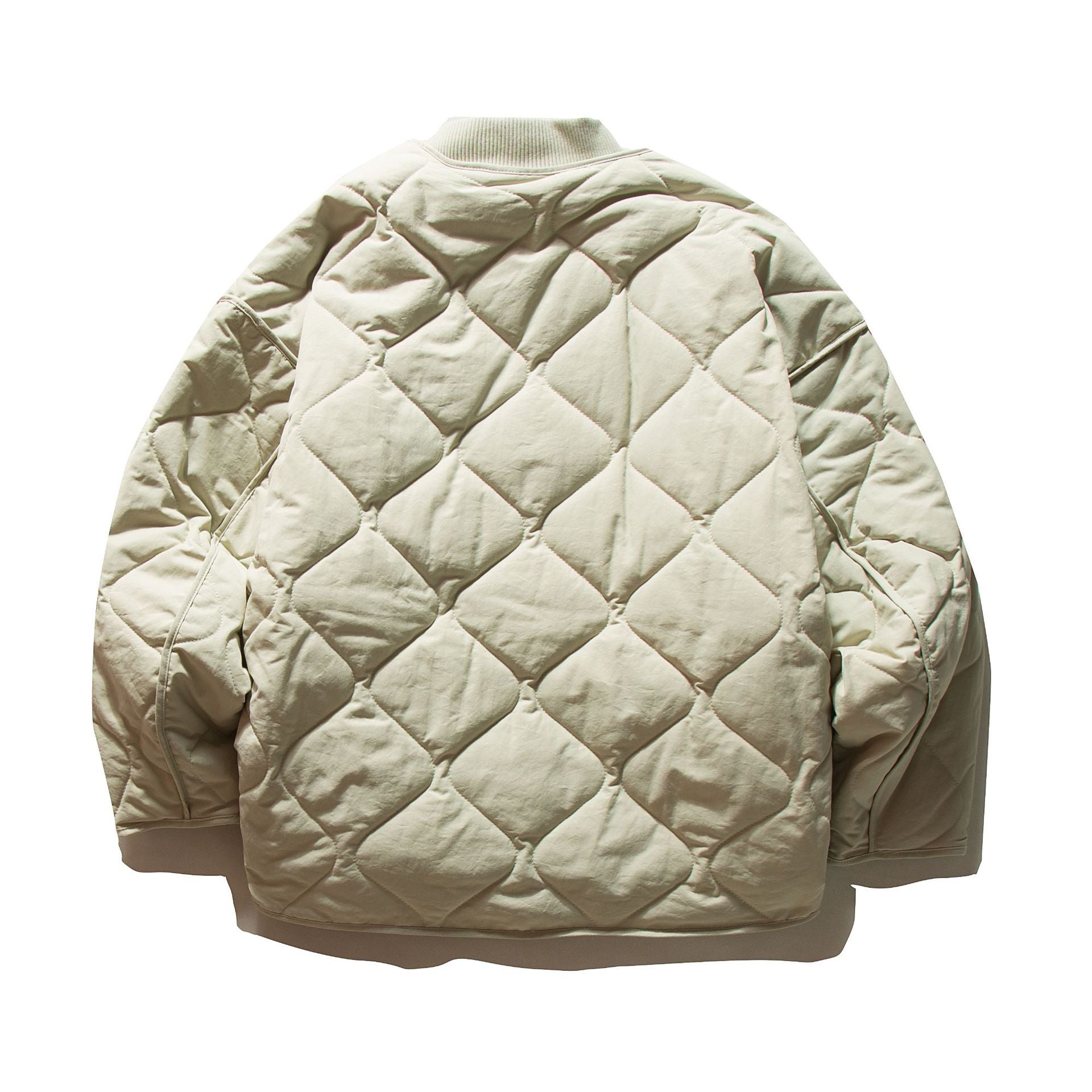 Unisex Short quilted bomber in boxy cut with ribbed collar and extra large flap pockets Chichicherry