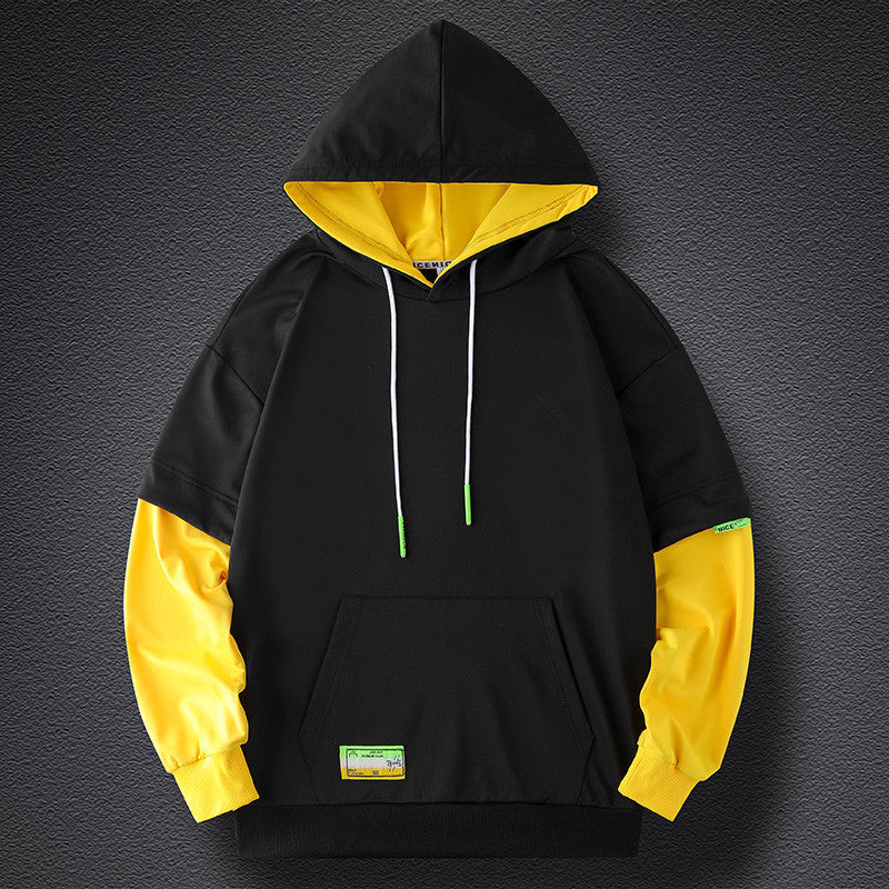 Men's hoodie in layered look with contrast sleeves, kangaroo pocket, and oversized cut Chichicherry