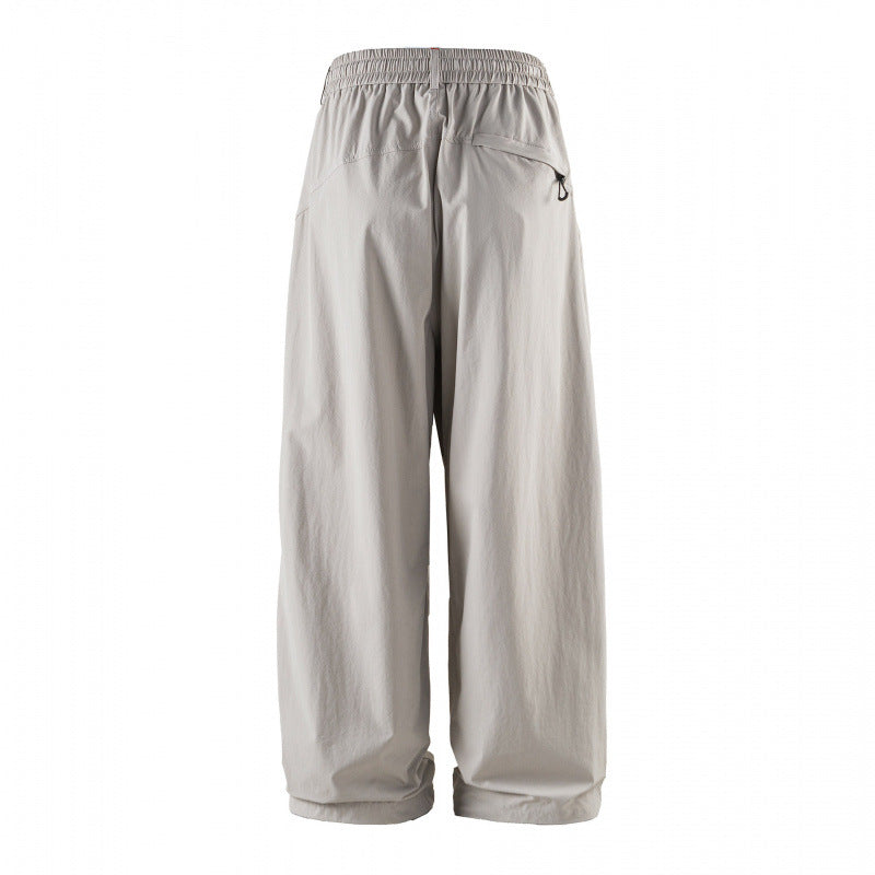 Unisex Loose-fitting technical cargo pants with elastic waistband, drawstring, and zip pockets Chichicherry
