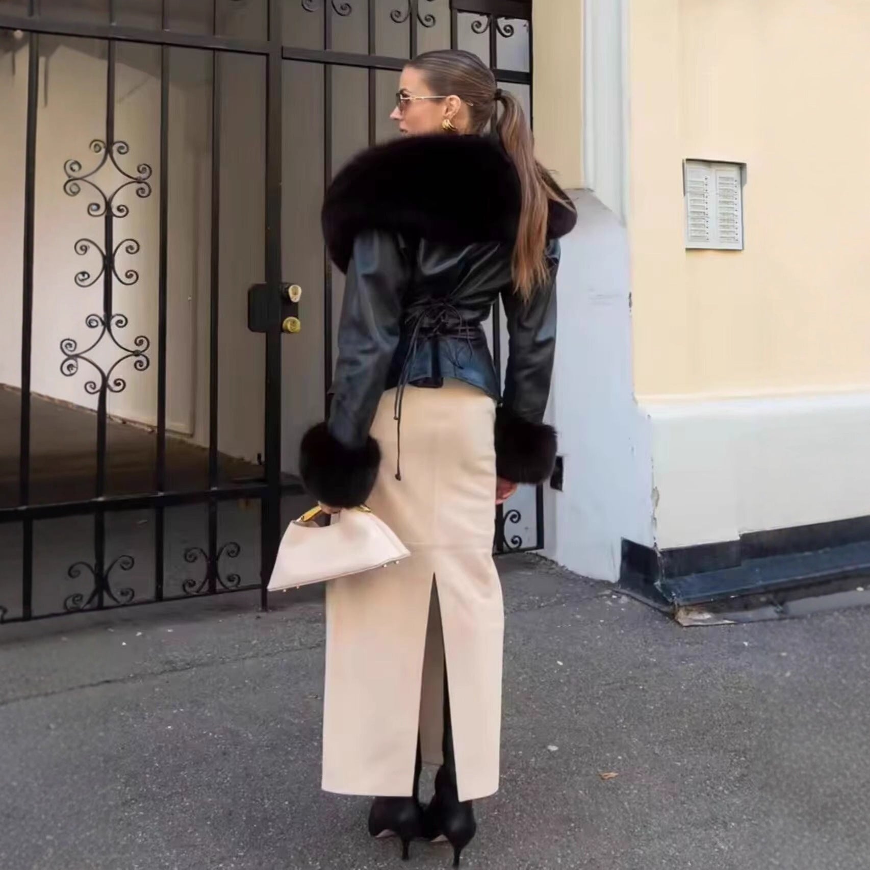 Women's short jacket made of synthetic leather with voluminous faux fur collar and fur cuffs Chichicherry