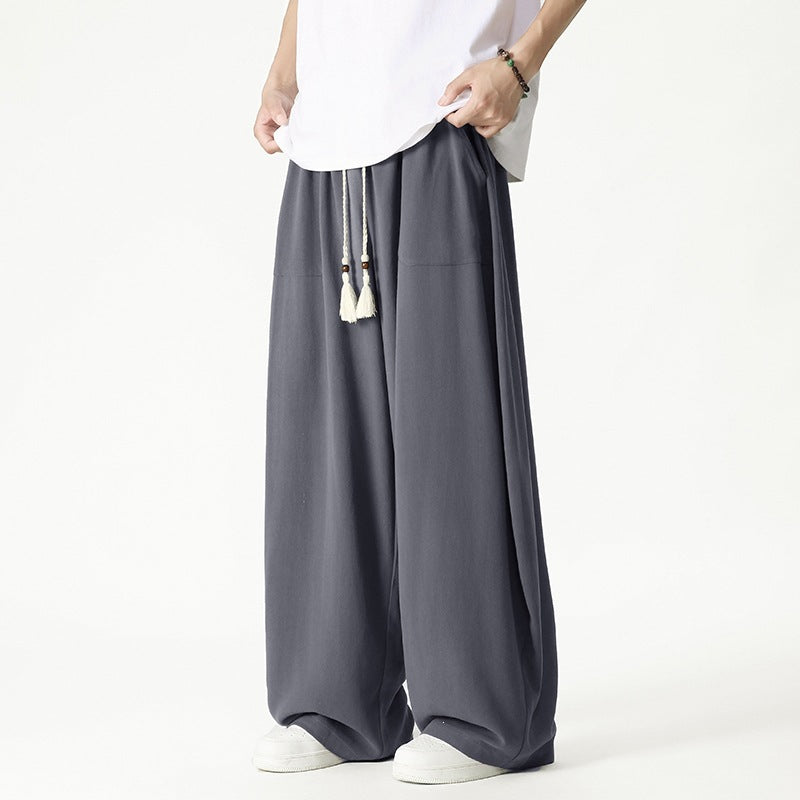 Men's loose-fitting lounge pants with tassel cord, elastic waistband, and patch pockets Chichicherry