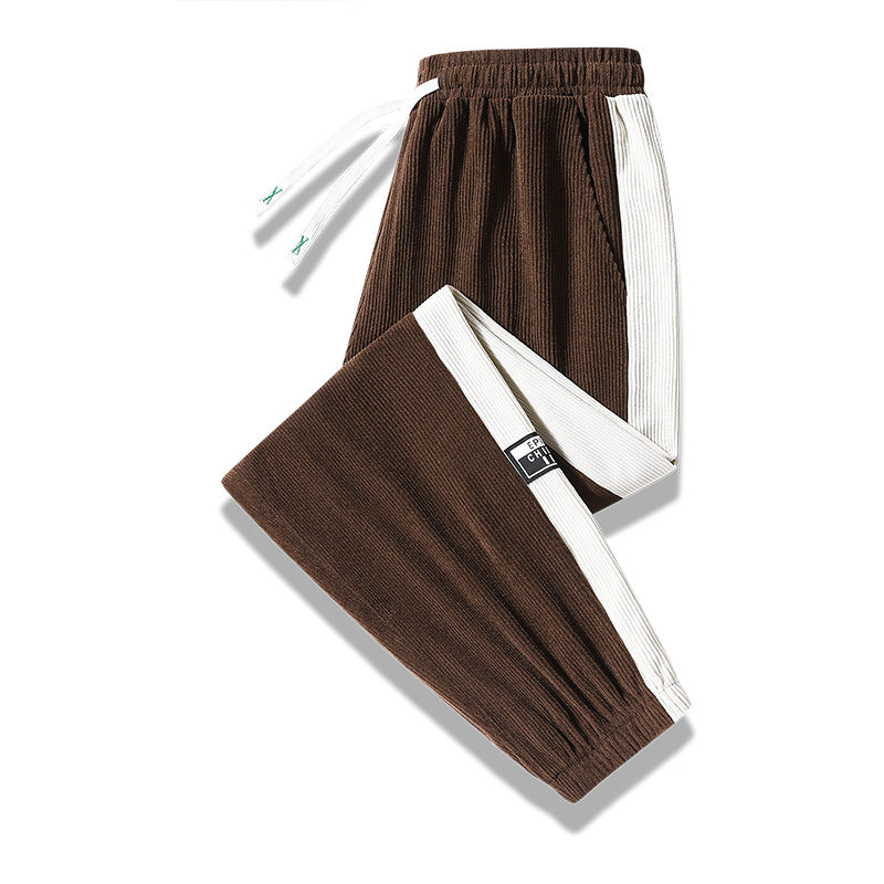 Men's jogging pants made of ribbed cotton blend with contrasting side inserts and elastic hem