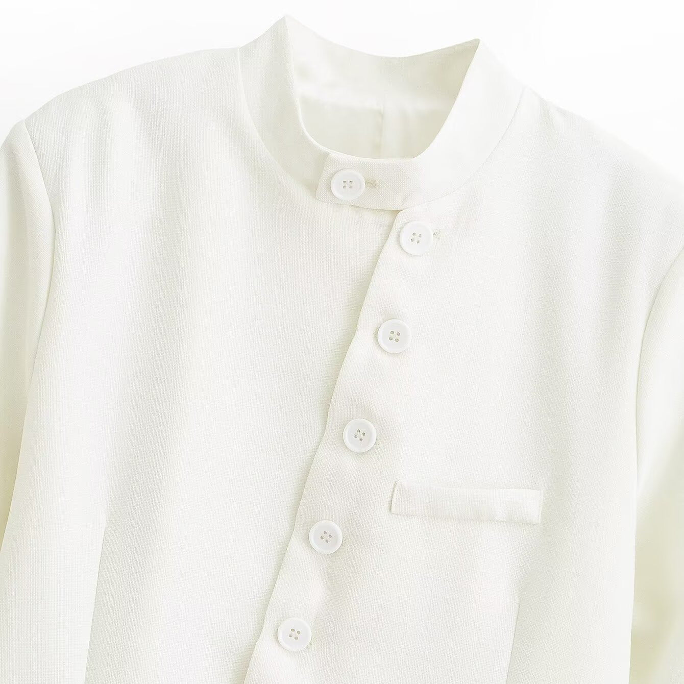 Women's asymmetrical buttoned short blazer with stand-up collar and patch pockets Chichicherry