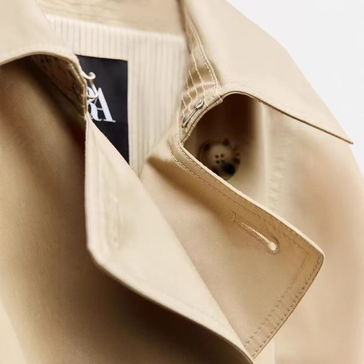 Women's Longer tailored trench coat with double-breasted button placket, waist belt, and sleeve tab Chichicherry