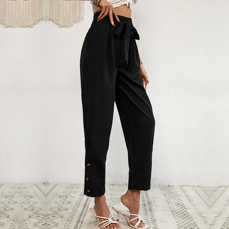 Ladies high-waisted paperbag trousers with tie belt, tapered leg and decorative button placket Chichicherry