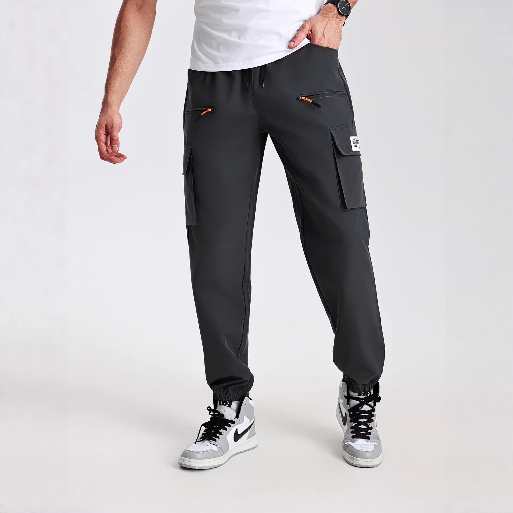 Men's tapered cut utility cargo pants in jogger style with drawstring waistband, zippered pockets & elastic leg cuffs Chichicherry