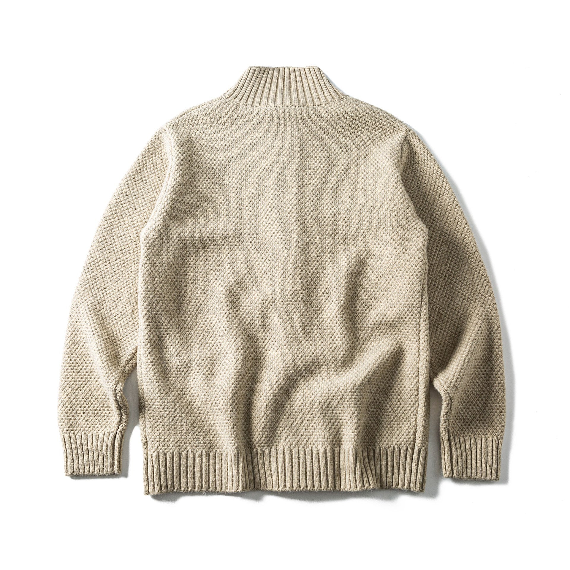 Women's bulky knit cardigan with high ribbed collar, button placket and patch pockets