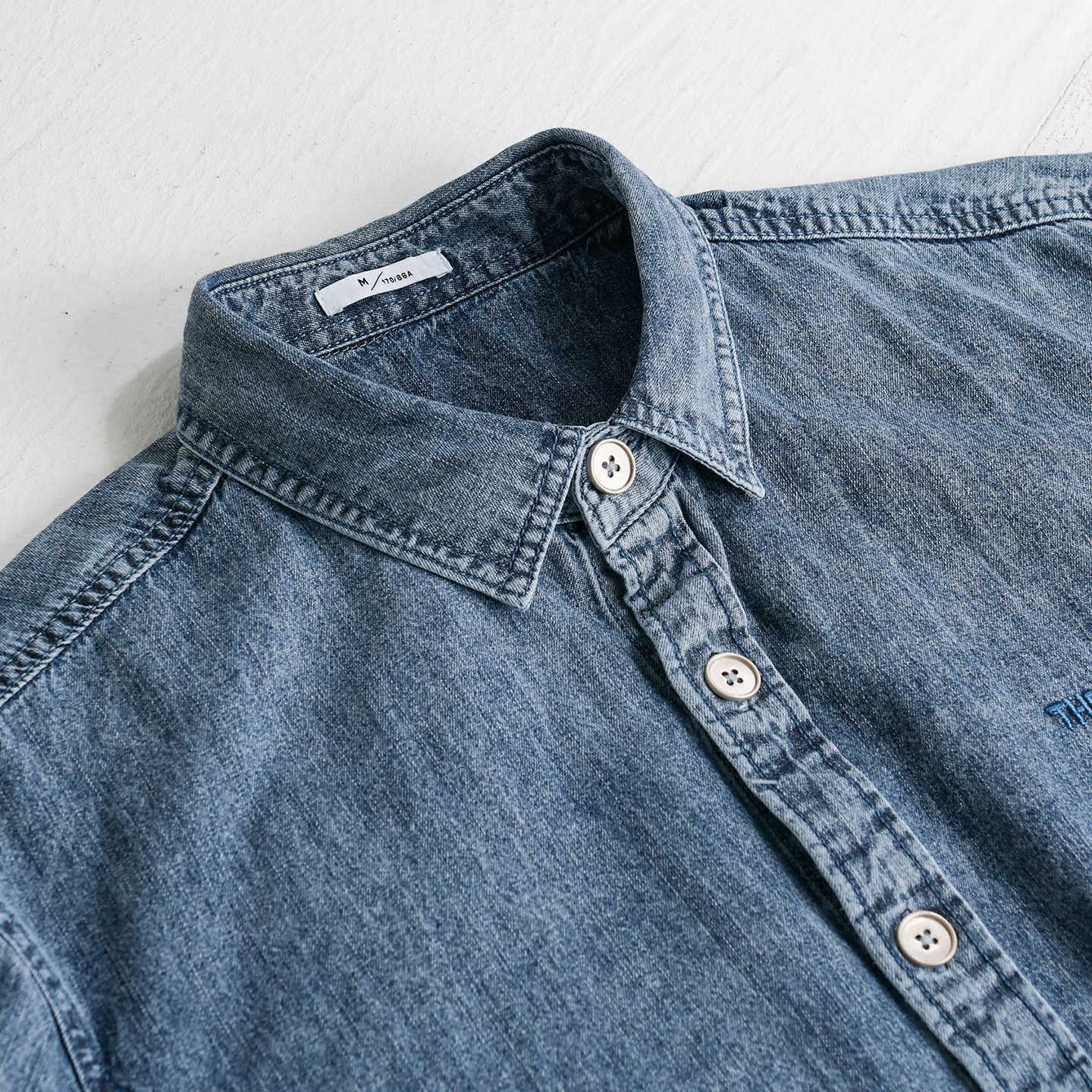 Men's relaxed denim overshirt with button placket and chest embroidery Chichicherry