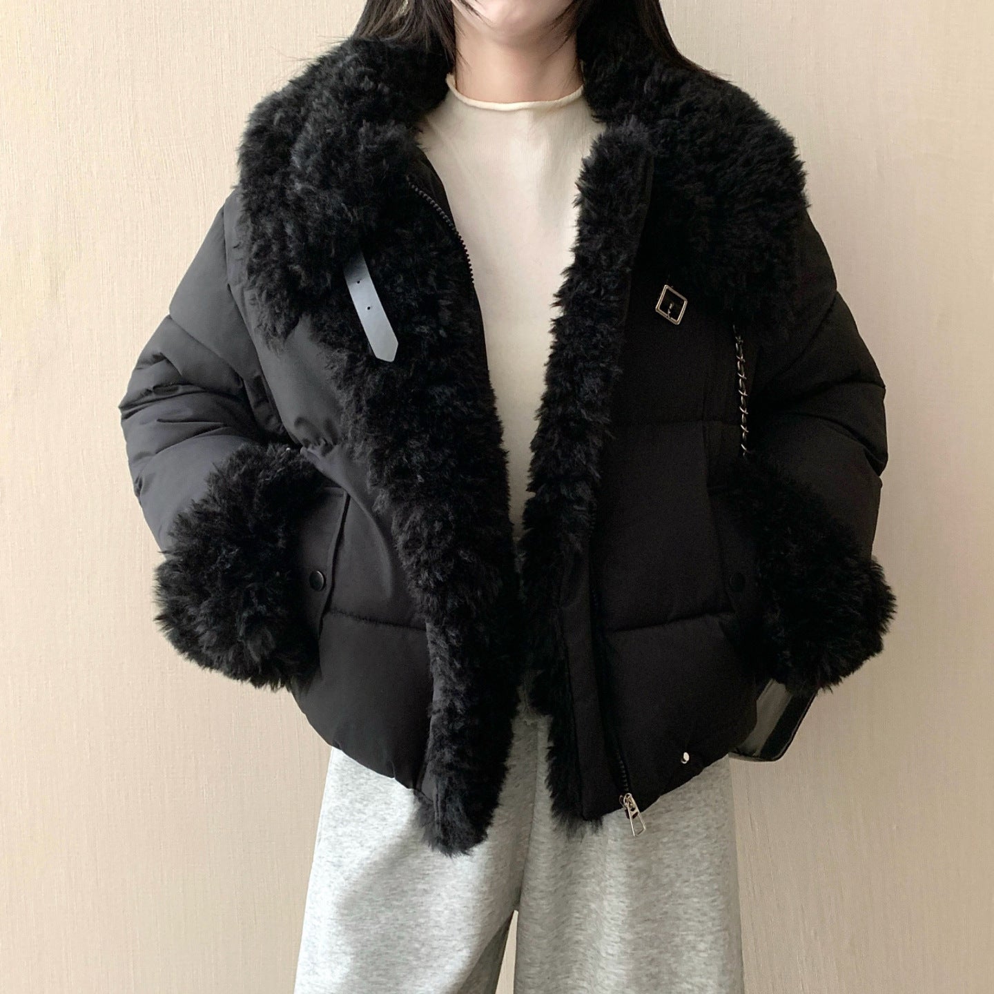 Women's short tailored puffer jacket with voluminous faux fur collar, buckle and zipper details Chichicherry