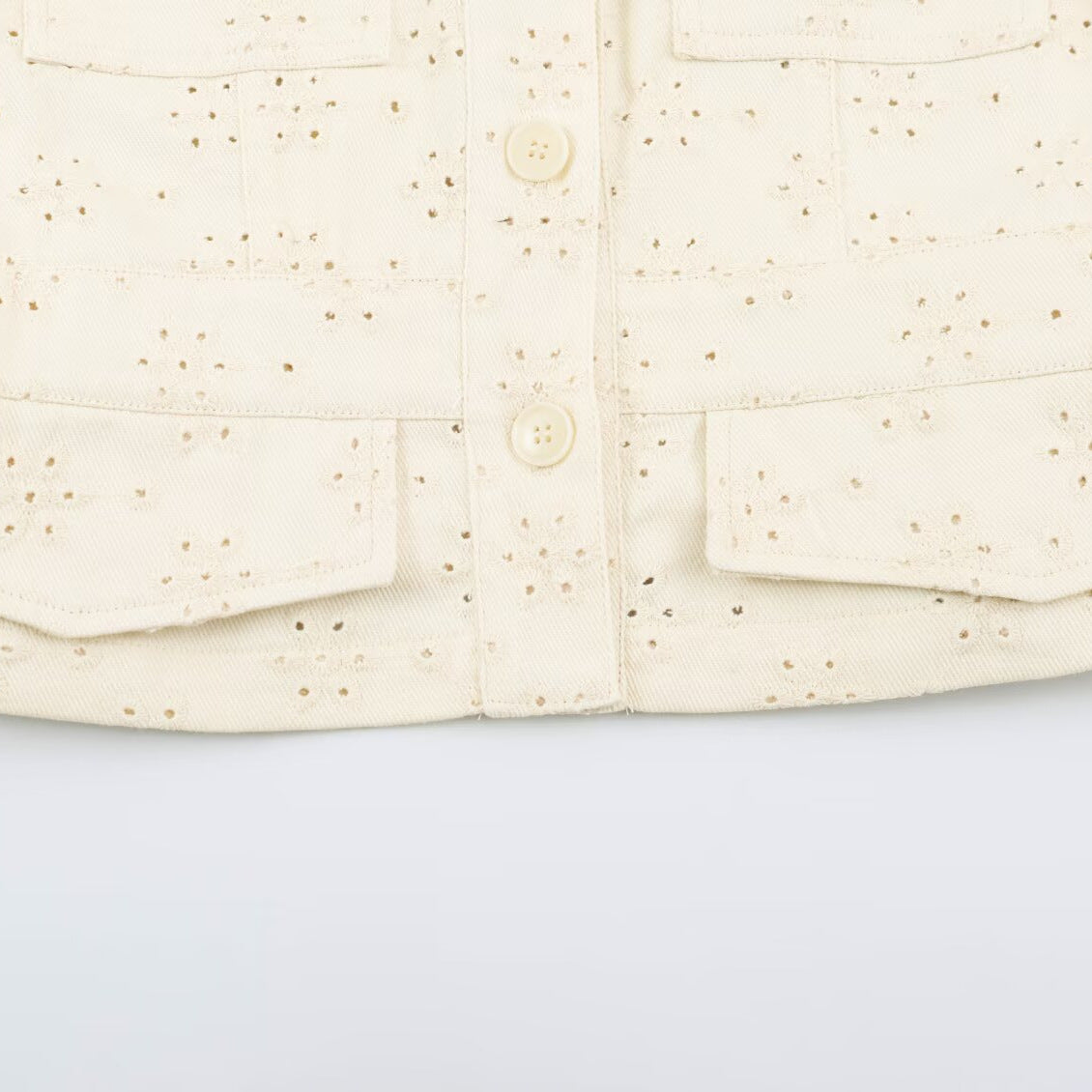 Ladies short jacket made of broderie anglaise with stand-up collar and patch pockets Chichicherry