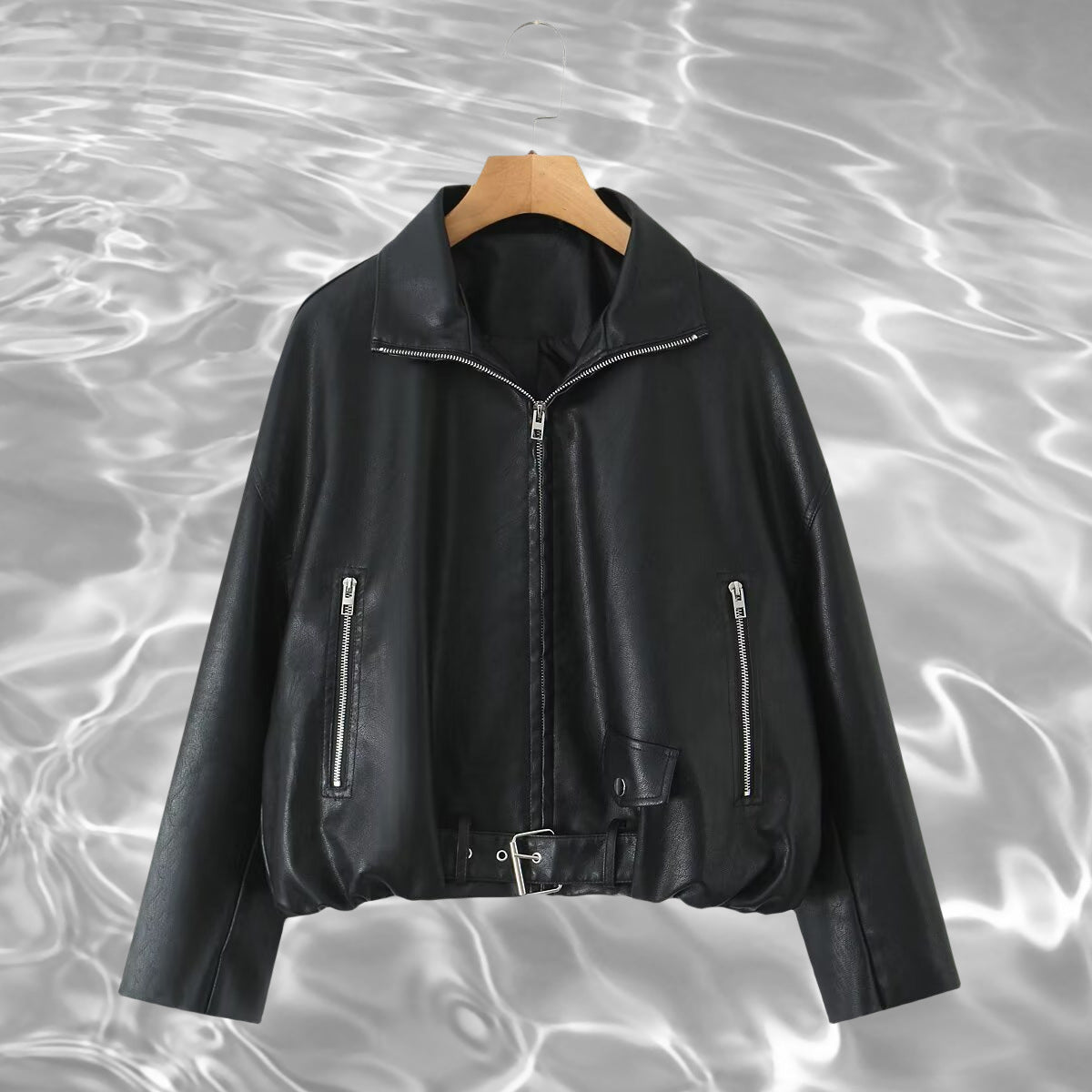 Women’s cropped oversized leather jacket in bomber style with zippered pockets and waist belt Chichicherry