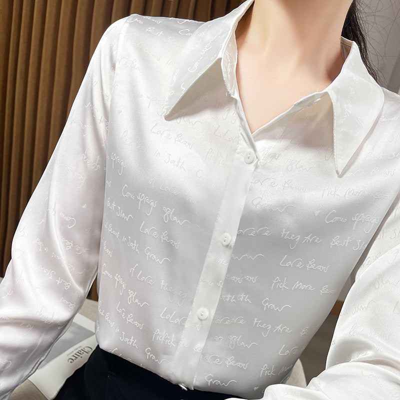 Women’s satin blouse with delicate jacquard writing, pointed shirt collar and continuous button closure Chichicherry