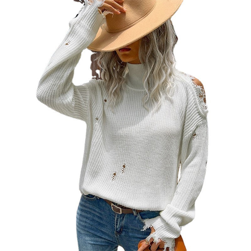 Women's oversized knit pullover in destroyed look with turtleneck and cut-out shoulders