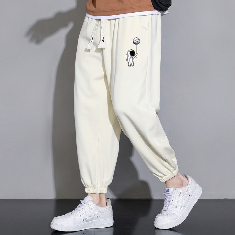 Men's Loose Jogging Pants with Astronaut Print, Drawstring Waistband and Elastic Cuffs Chichicherry
