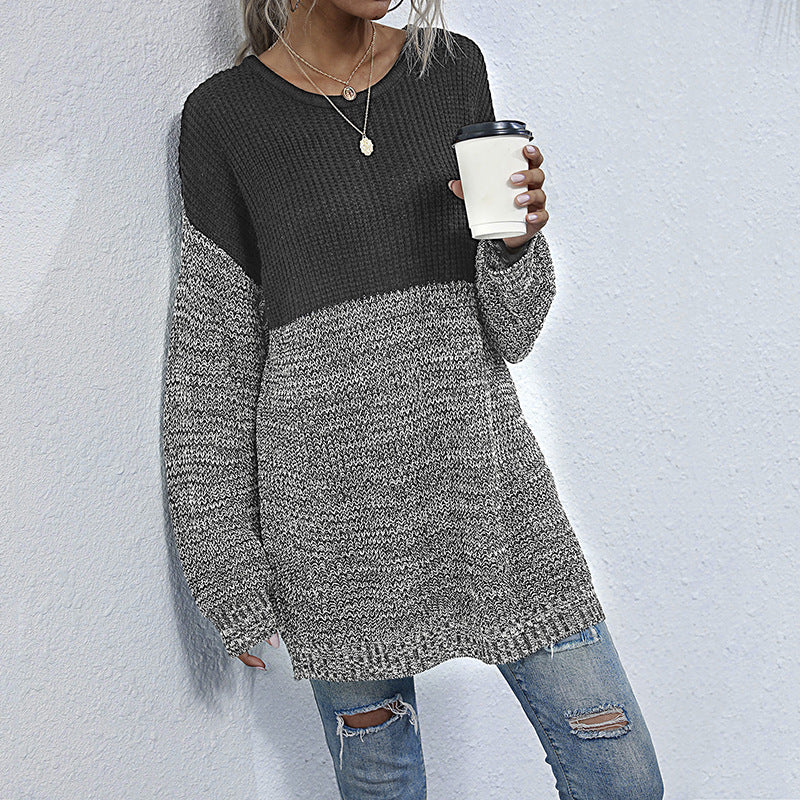 Women's oversized knitted sweater with color block look, round neckline, and mottled textured knit.