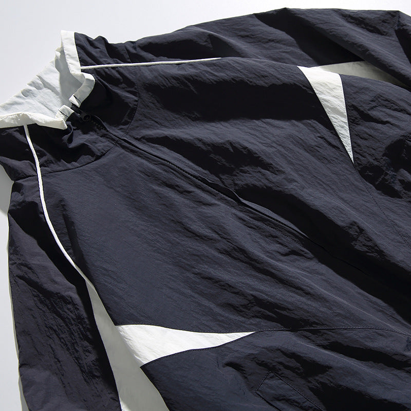Unisex Lightweight Boxy Hooded Jacket in Windbreaker Style with Contrast Panels and Raglan Sleeves Chichicherry