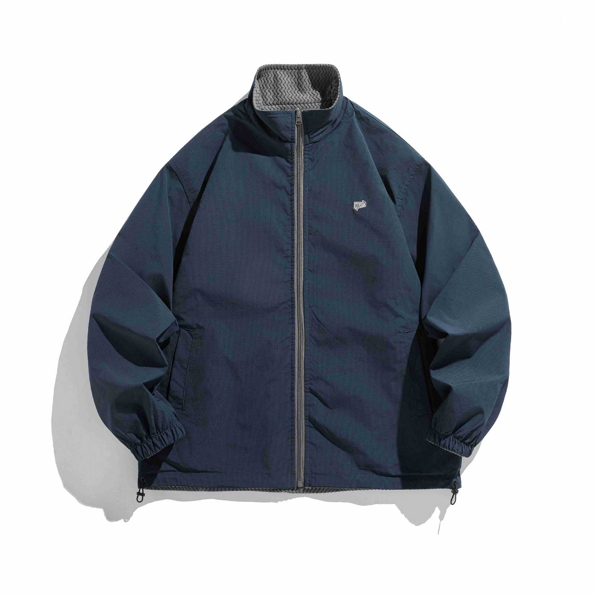 Unisex structure fleece jacket with high stand-up collar, zip pockets and drawstring hem Chichicherry