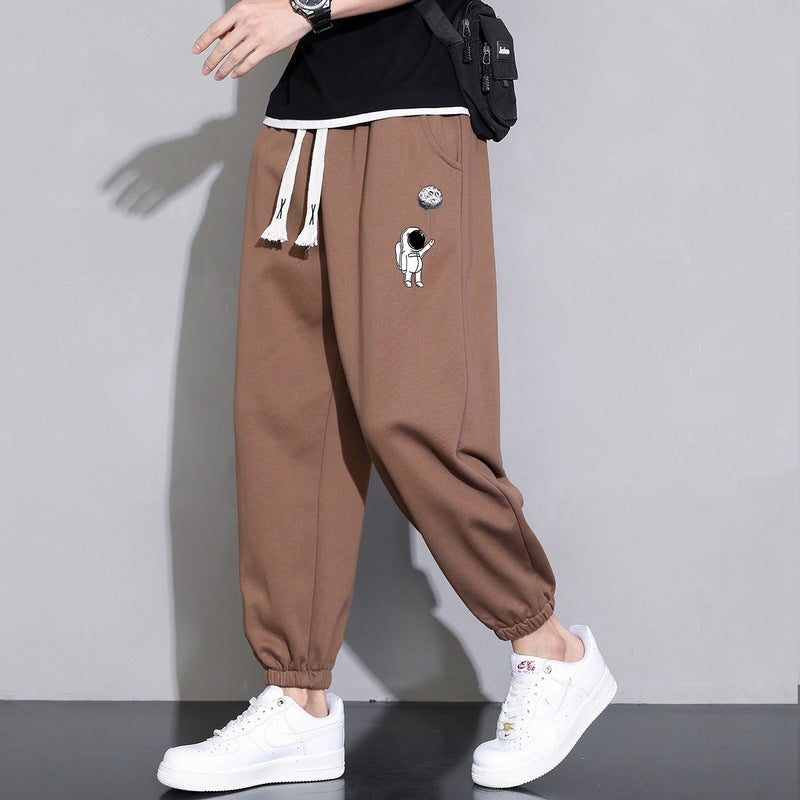Men's Loose Jogging Pants with Astronaut Print, Drawstring Waistband and Elastic Cuffs Chichicherry